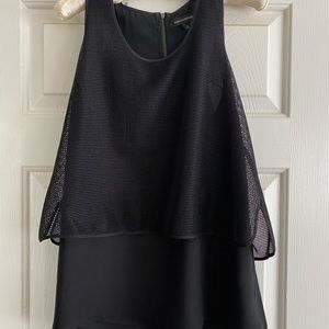 Layered sleeveless top with mesh overlay